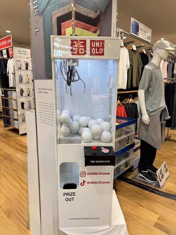 Uniqlo Polo Park brand activation claw machine Partyology Inc Winnipeg
