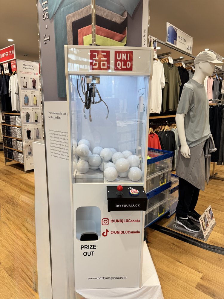 Uniqlo Polo Park brand activation claw machine rental Partyology Inc Winnipeg
